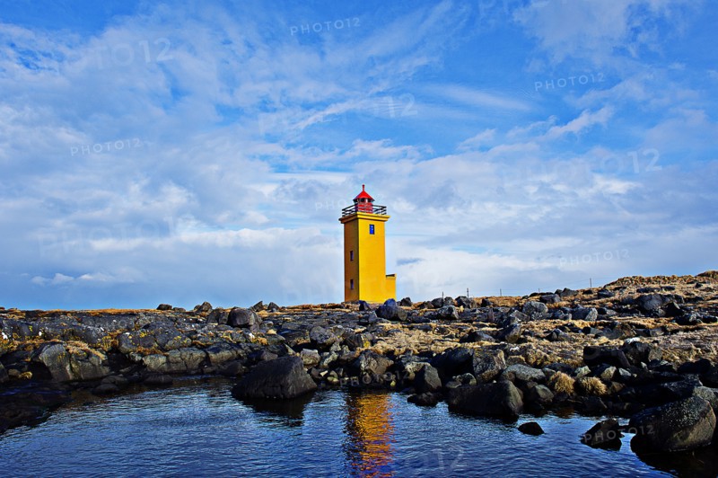 Lighthouse overlooking rocky landscape