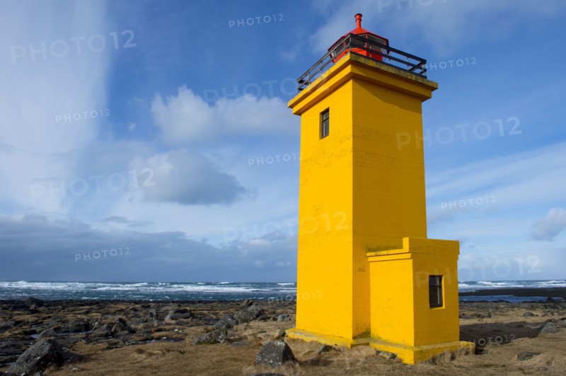 Lighthouse overlooking rocky beach