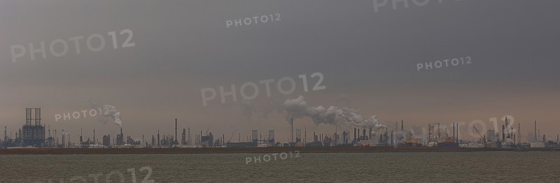 Smoke billowing from distant factory
