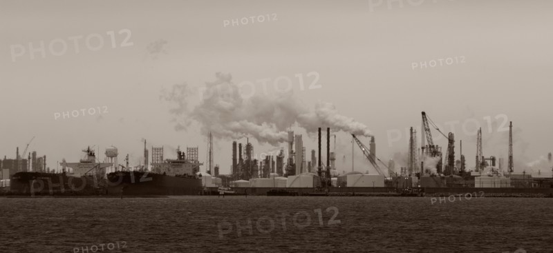 Smoke billowing from distant factory