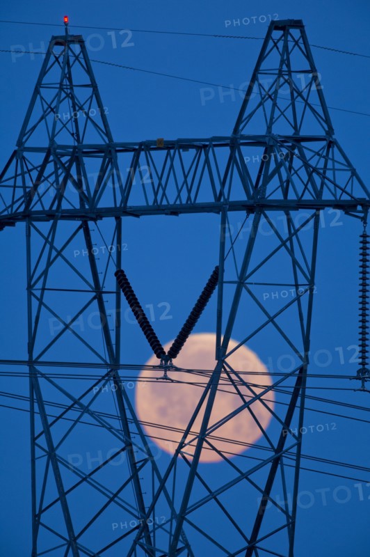 Moon viewed through power lines