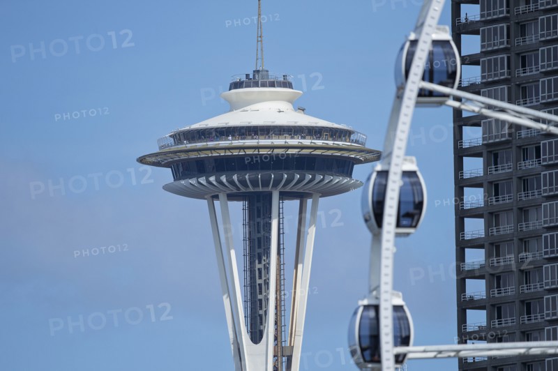 Space Needle overlooking Ferris wheel