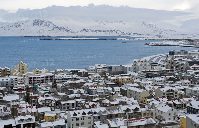 Aerial view of snowy city in rural landscape