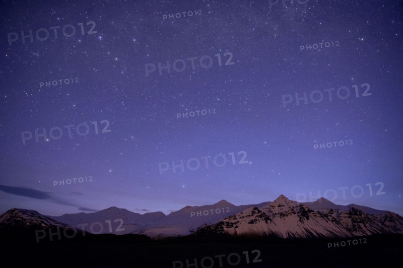 Starry sky over arctic landscape