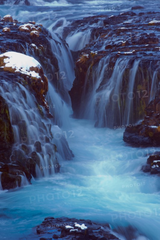 Waterfall flowing over cliff