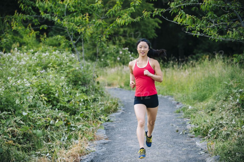 Korean woman running on remote path