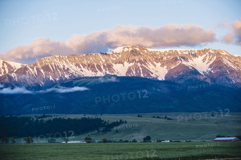 Mountains over farmlands in rural landscape