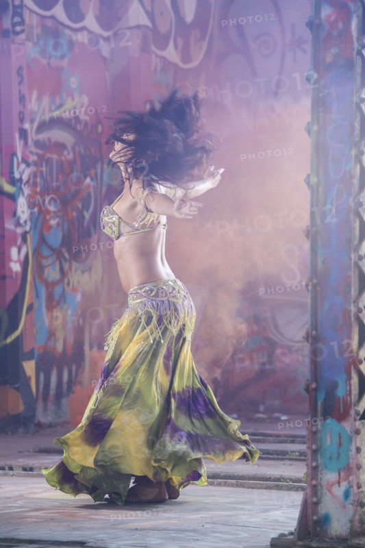 Belly dancer spinning on stage