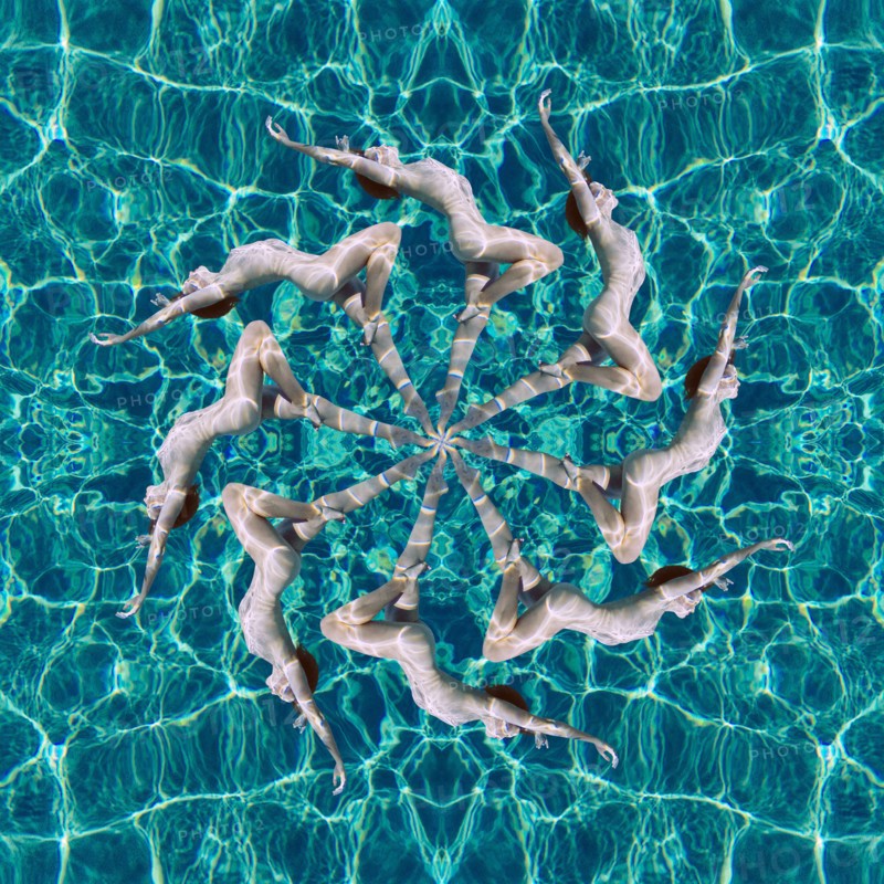 Multiple exposure of Caucasian woman swimming in spiral