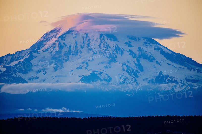 Clouds over snowy mountain