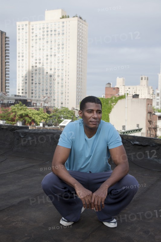 African American man standing on rooftop