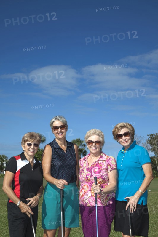 Senior Caucasian women playing golf
