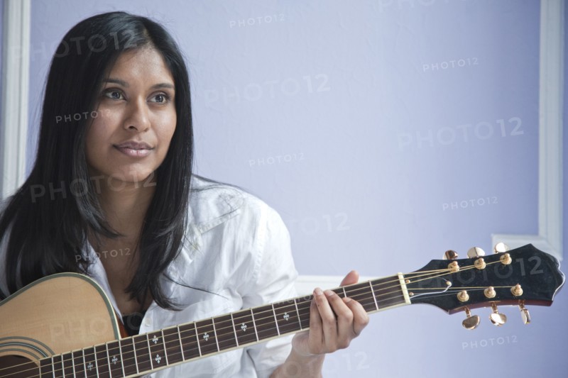 Sri Lankan woman playing guitar