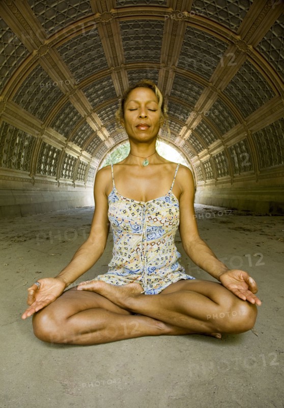 Mixed race woman practicing yoga