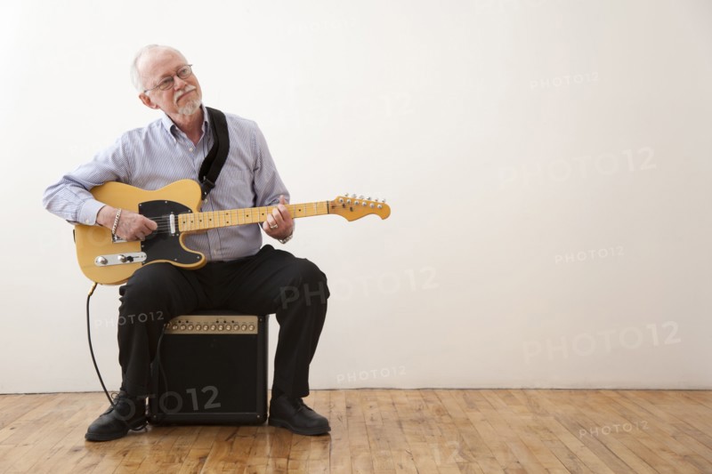 Caucasian man playing electric guitar