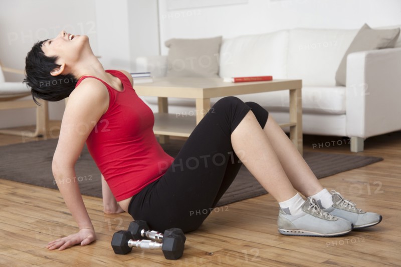 Woman laughing in living room