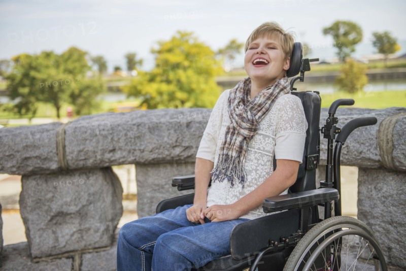Paraplegic woman laughing in wheelchair