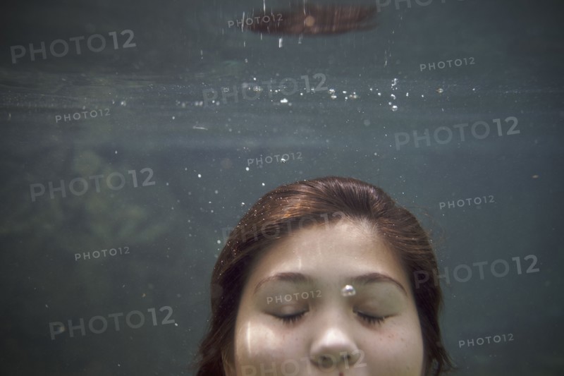 Mixed race teenager underwater