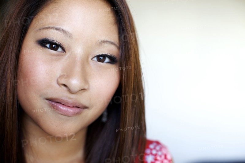 Close up of smiling mixed race teenage girl