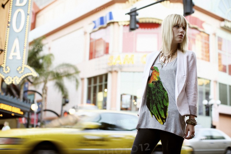 Caucasian woman standing on city street
