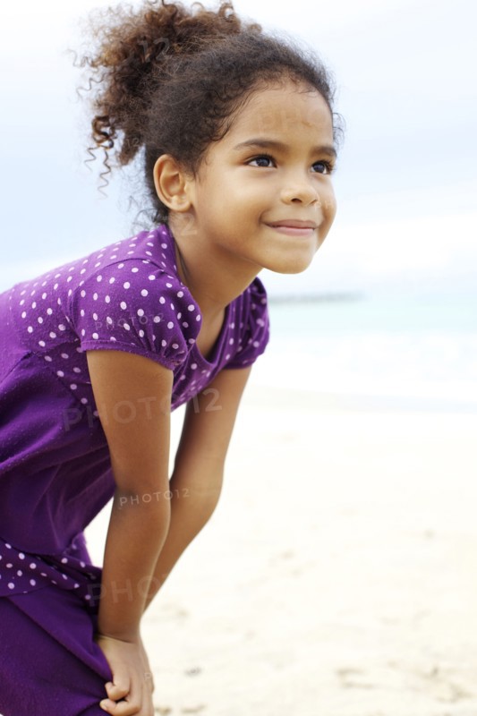 Mixed race girl on beach