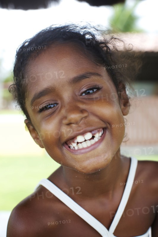 Grinning mixed race girl