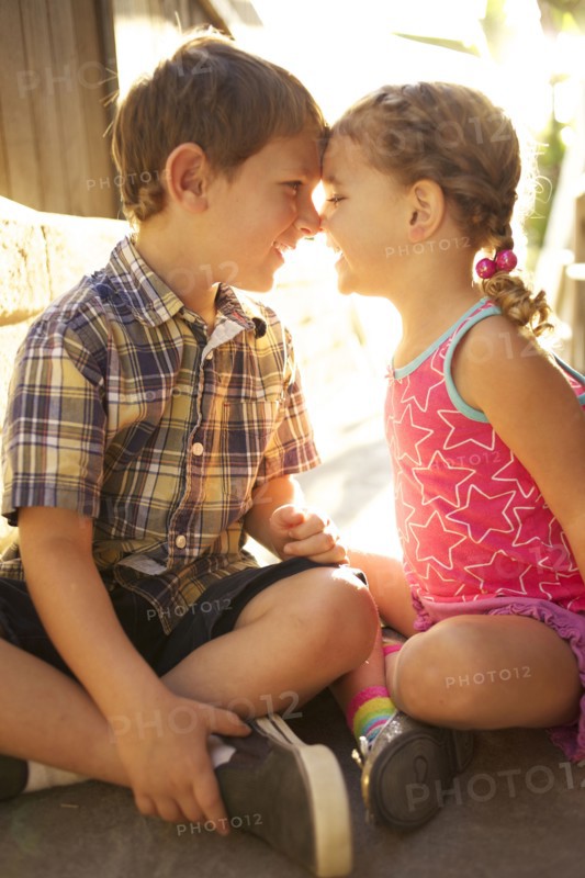 Brother and sister looking at each other
