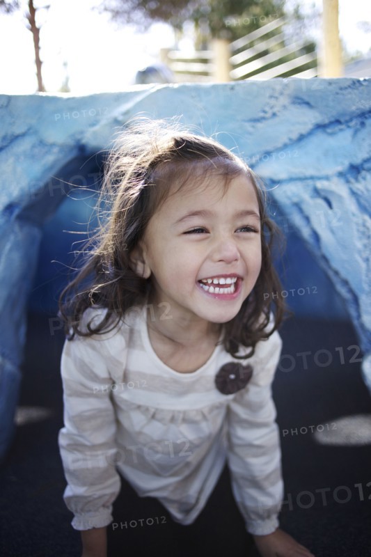 Grinning mixed race girl crawling