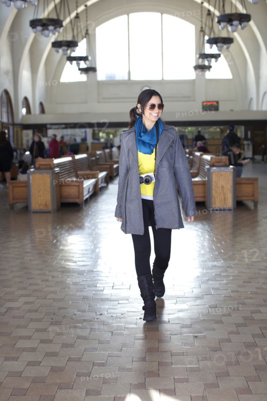 Mixed race woman walking in historic building