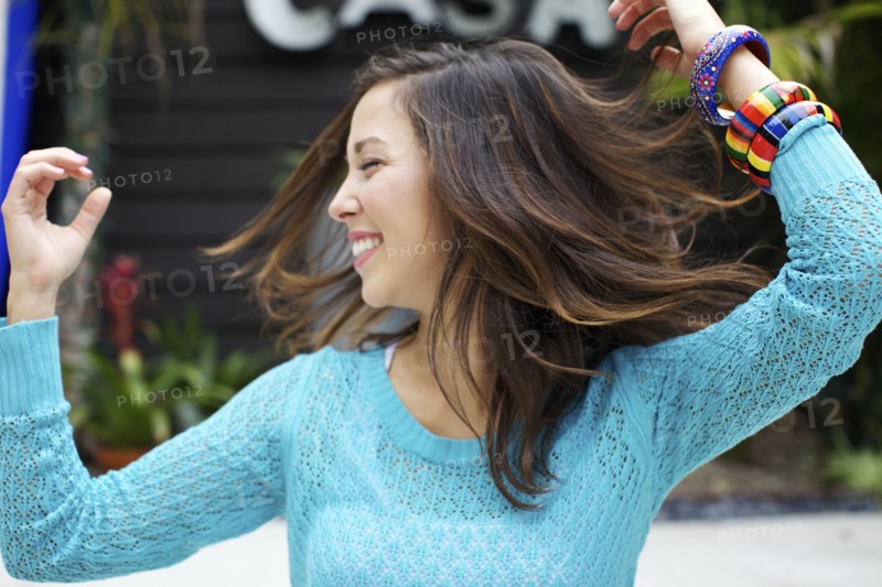 Mixed race woman dancing outdoors
