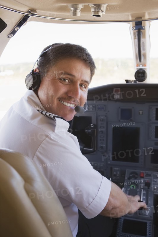 Hispanic pilot in cockpit