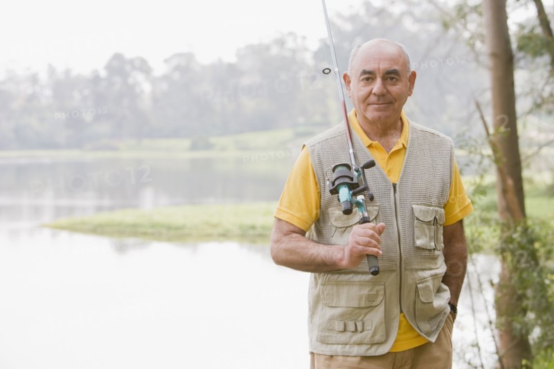 Senior Hispanic man fishing