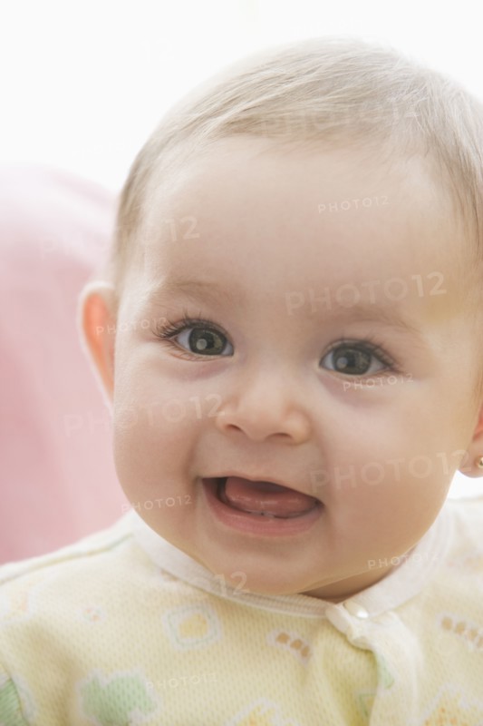 Smiling Hispanic baby girl