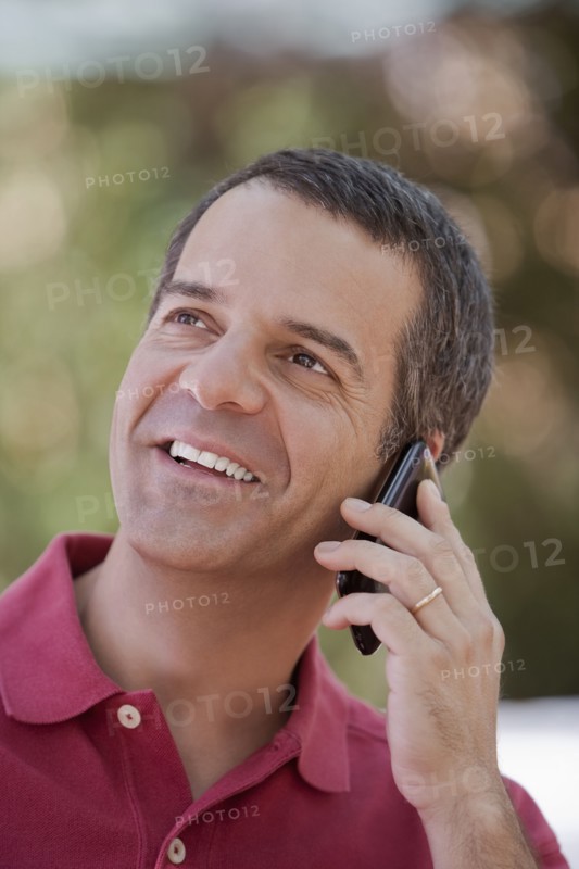 Hispanic man talking on cell phone
