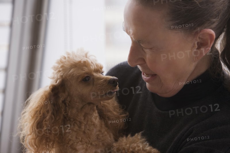 Chilean woman hugging dog