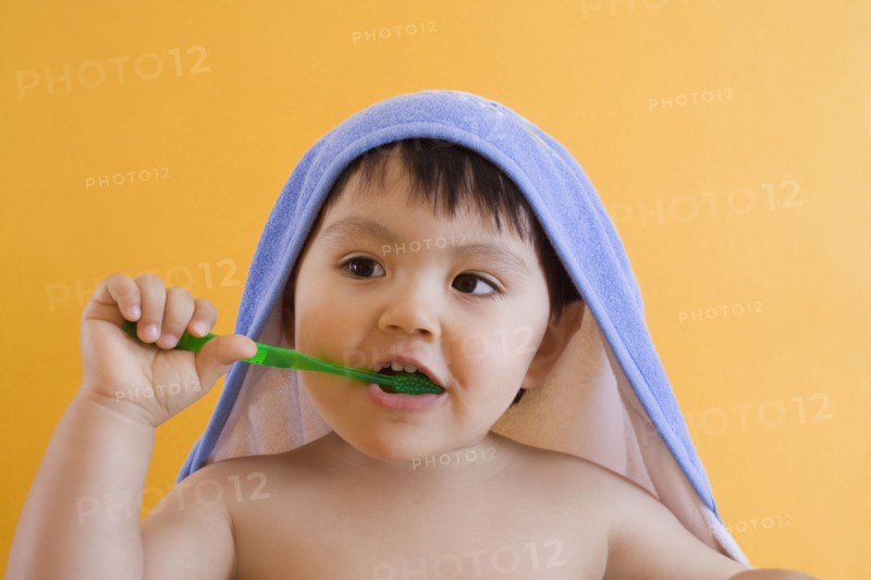Hispanic boy brushing teeth