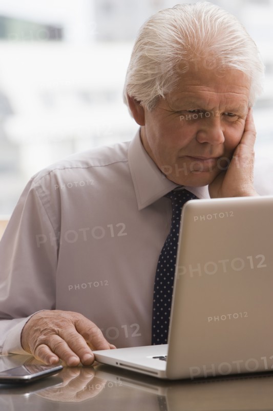 Chilean businessman working on laptop