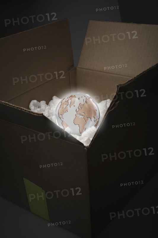 Glowing globe in delivery box