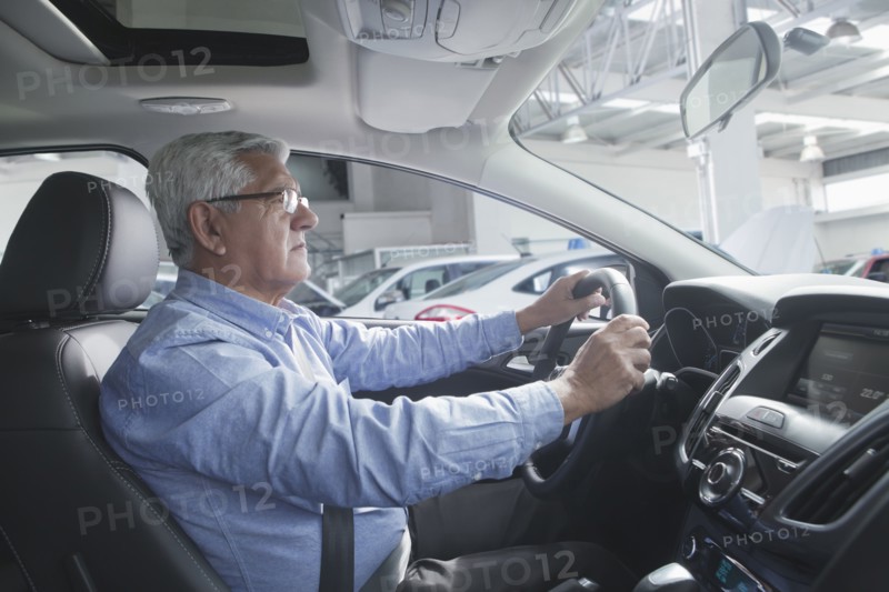 Hispanic customer test driving new car