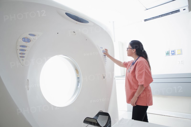 Hispanic nurse checking scanner