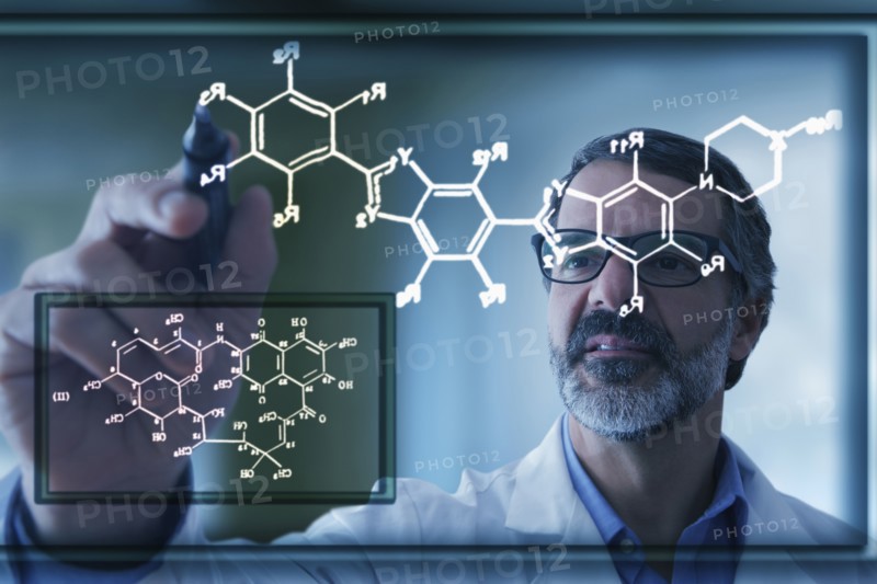 Hispanic scientist drawing chemical model on virtual screen