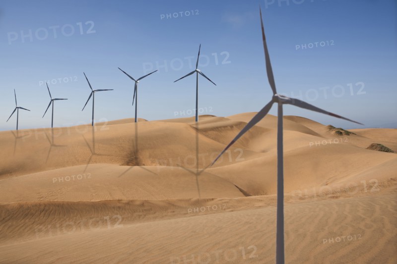 Row of wind turbines in desert