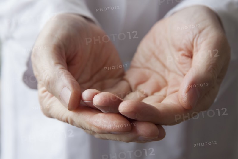 Cupped hands of Hispanic doctor