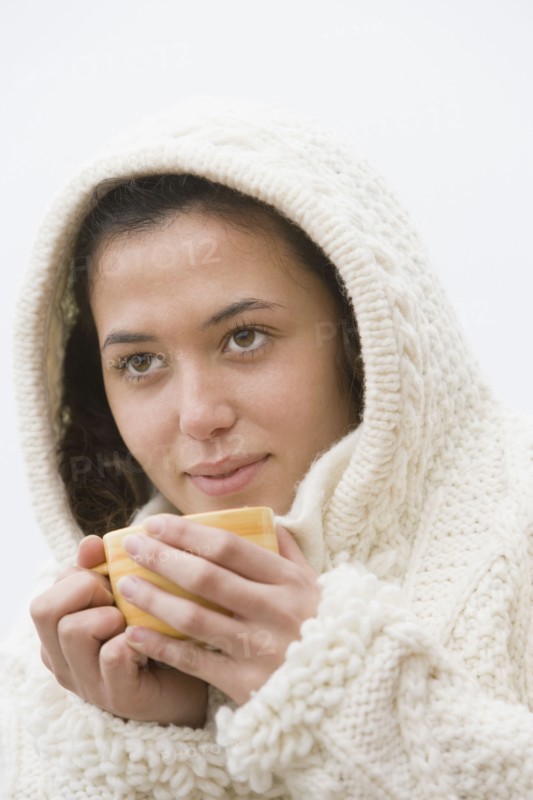 Hispanic woman drinking coffee