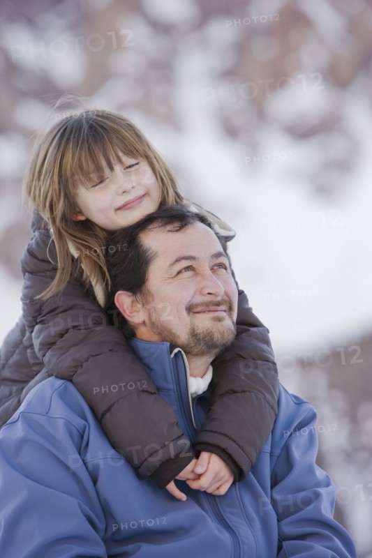 Hispanic daughter hugging father