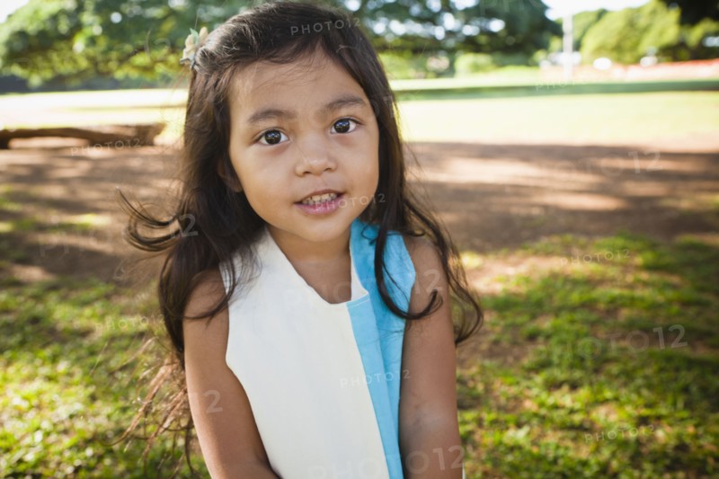 Smiling girl standing outdoors