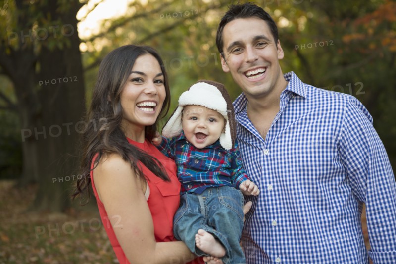 Family smiling together outdoors