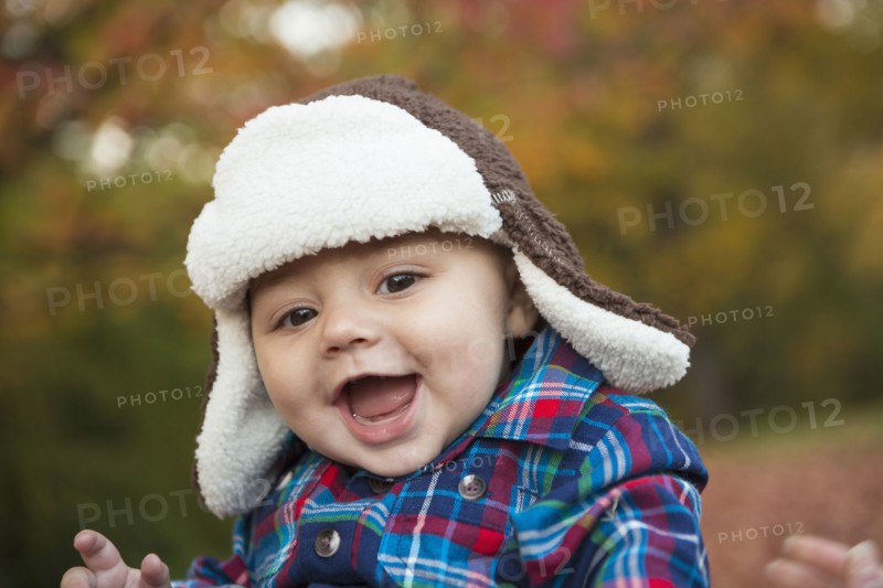 Baby smiling outdoors