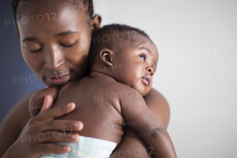 Close up of Black mother holding baby