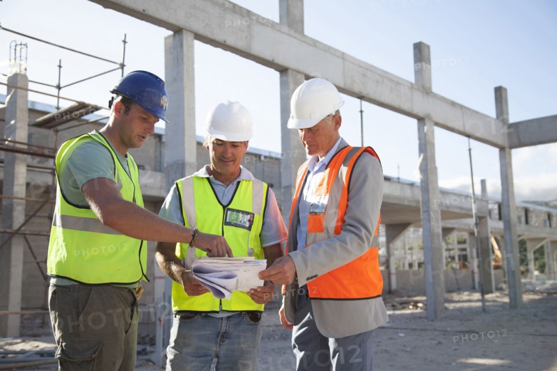 Architects talking at construction site